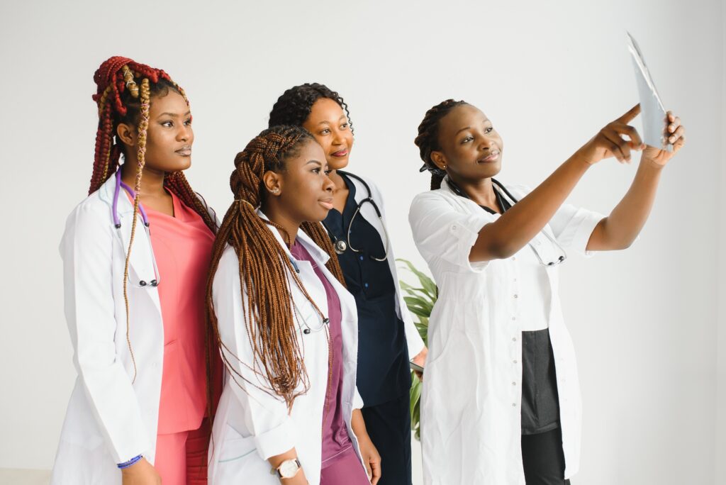 group of young african medical workers on white background.